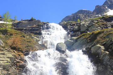 waterfall and rocks in mountain