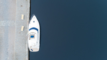 Beautiful white luxury boat docked  in port. Copy space.