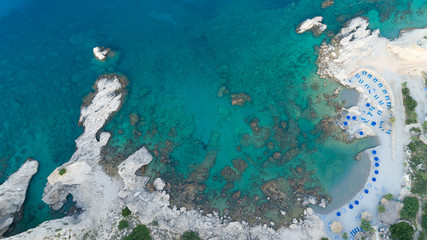 Fototapeta na wymiar Aerial drone photo of paradise organised with sun beds and umbrellas. Beautiful turquoise water. 