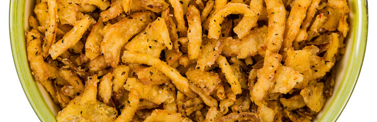 Crispy Fried Onion Strings Background. Selective focus.