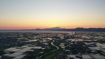 Sunset seen from a vast plain