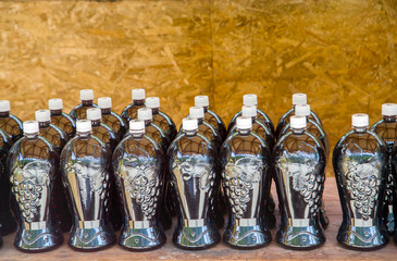 plastic bottles for storing liquids filled with honey