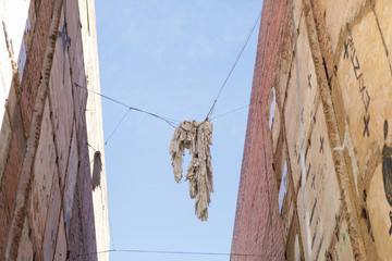 laundry hanging on a clothesline, urban scene. Laundry lines in and cables with white fabric in Barcelona