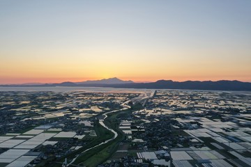 Sunset seen from a vast plain