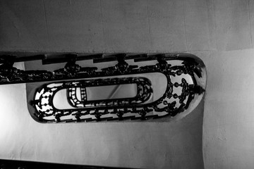 Metal stairs and handrails in a historic building. Interior, vertigo.