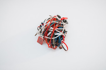 plugs, isolated on white background. A ball of colored wires. A ball of bright multi-color network...
