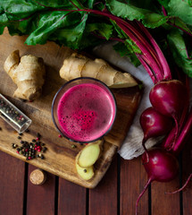 Fresh spicy beetroot juice with Ginger, flat lay