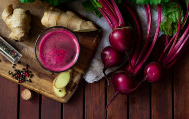 Fresh spicy beetroot juice with Ginger, flat lay