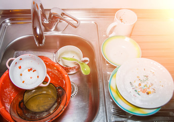 Dirty dishes, A bunch of dirty dishes in the sink and countertop after a party