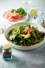 Healthy green salad with ham and avocado