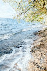 Swing on the beautiful beach with white sand and crystal clear blue water background for tourism concept