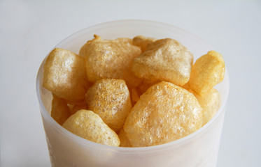 Cattle skin crackers on white background.