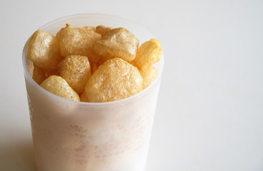 Cattle skin crackers on white background.