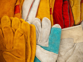Construction gloves. Multicolor, rough skin.