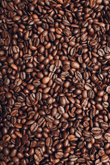 Roasted coffee beans brown seeds texture background wallpaper.