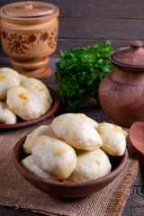 Russian, Ukrainian or Polish dish: varenyky, vareniki, pierogi, pyrohy. Dumplings, ffilled with cabbage