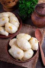 Russian, Ukrainian or Polish dish: varenyky, vareniki, pierogi, pyrohy. Dumplings, ffilled with cabbage