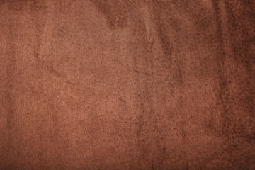 Brown velor textural background pattern. Gorgeous elastic velor fabric has a velvet pile, shine and texture.