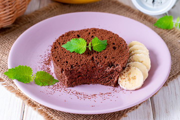 Fototapeta na wymiar Chocolate Sponge Banana Cake with cocoa