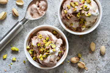 Chocolate, vanilla ice cream with pistachios. View from above.