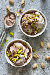 Chocolate, vanilla ice cream with pistachios. View from above.