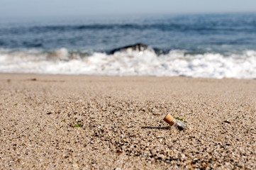 Digital message in a bottle in sand on the beach