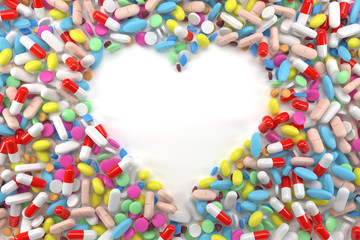 Heart frame of pills on white