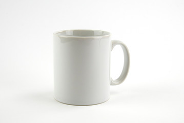 Blank white mug on isolated white background