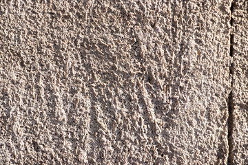Beige painted grunge wall rough texture
