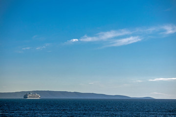Big modern luxury cruise ship on the sea and sky background, Adriatic sea in Croatia