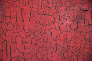 Red painted worn grunge vintage cracked weathered wall surface texture background