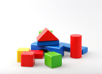 Obraz premium Studio Shot Of Colorful Toy Blocks Against White Background
