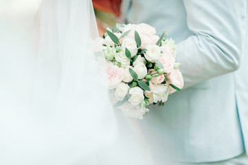 Fototapeta premium Diamond jewelry on a bridal bouquet.