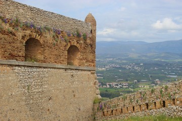 Palamidi Castle in Nafplio, Peloponnese, Greece. Built in 1714. Castle wall, pinnacle and surrounding mountain landscape. South-east Europe.