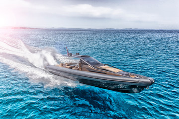 Fototapeta premium inflatable motor boat in formentera, spain
