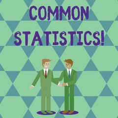 Handwriting text Common Statistics. Conceptual photo used to calculate values related to statistical concepts Two Businessmen Standing, Smiling and Greeting each other by Handshaking