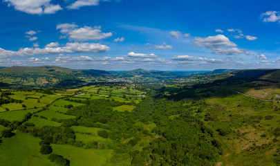 Aerial panorama of green fields and farmland in rural South Wales