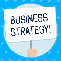 Word writing text Business Strategy. Business photo showcasing working plan of a business for achieving its vision Hand Holding Blank White Placard Supported by Handle for Social Awareness