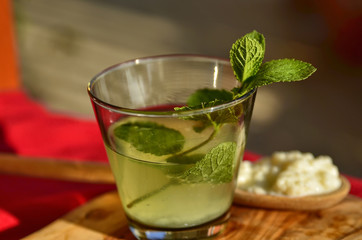 Water kefir drink with fresh mint leaves
