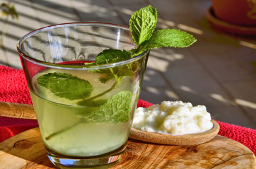 Water kefir drink with fresh mint leaves