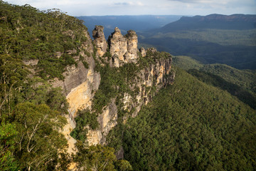 Three sisters rock formation with last sunlight in the Blue Mountains, Katoomba, New South Wales, Australia