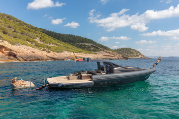 Fototapeta na wymiar people in relax on theinflatable motor boat in formentera, spain