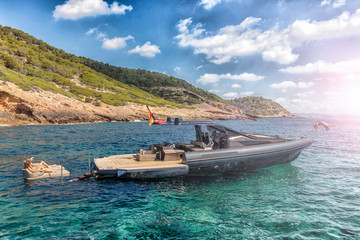 Fototapeta na wymiar people in relax on theinflatable motor boat in formentera, spain