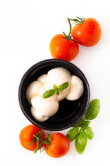 Food ingredient concept organic mozzarella cheese in black ceramic cup with copy space