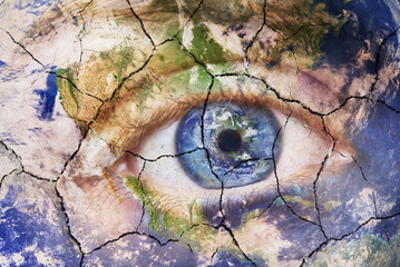 Earth extinction concept. Close up image of woman face with earth painted, cracked texture with...
