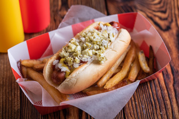 hot dog in basket with draft beer