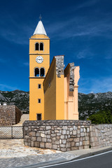 Two walls and tower of Catholic Church of St Charles of Borromeo from 1615. in town Karlobag, Croatia