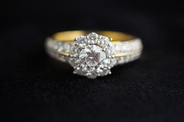 luxury jewelry diamond ring on black fabric background