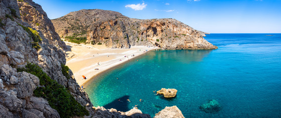 Agiofarago beach with natural caves and stone arches at the end of the gorge in Crete island, Greece - obrazy, fototapety, plakaty