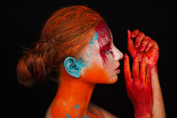 Portrait of a model in an expressive creative style using an unusual make-up